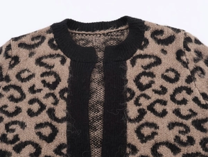 Close-up of leopard print cardigan fabric showing soft texture and ribbed collar detail