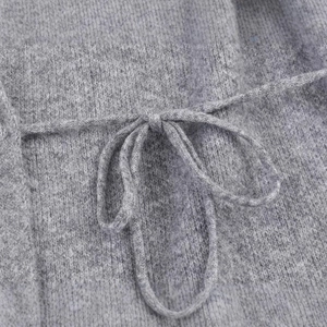 Elegant light heather grey knit cardigan featuring a stylish waist tie bow detail