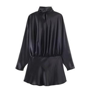 Detail of black satin long sleeve dress with high neck and back keyhole closure