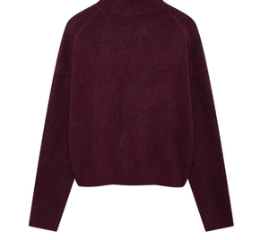 Detailed view of the rib-knit mock neck and soft texture of a burgundy sweater