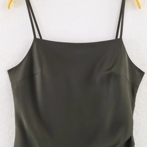 Elegant dark olive green satin camisole top with thin straps and a square neckline
