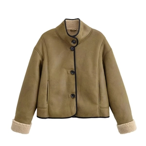 Detail view of olive green faux suede jacket with white faux fur lining and stand collar