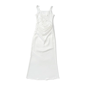 Detailed back view of white satin dress featuring cross-back lacing and ruched detailing