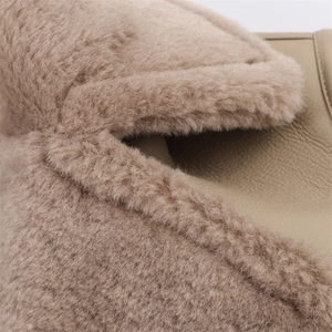Detail of premium camel faux fur and smooth leather texture with fine stitching