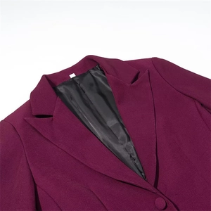 Close-up of elegant purple wool suit jacket lapel with feather trim and smooth black lining