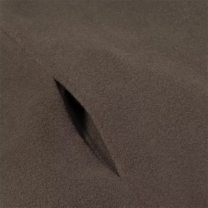 Detailed close-up of dark brown wool blend fabric and seamless slit design on the jacket