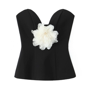 Detail of 3D white floral applique on a black strapless bodice with slim fit design