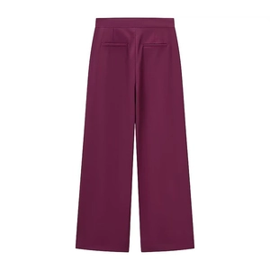 Detail of high-waist wide-leg plum trousers with back pockets and smooth fabric texture