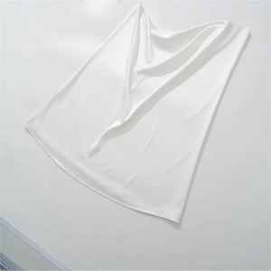 Elegant white satin maxi dress with slim fit and spaghetti straps in glossy silk fabric