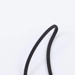 Macro shot of durable black satin strap with high-quality stitching detail