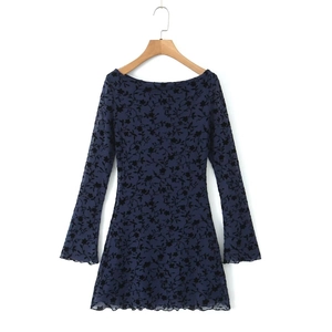 Detail of navy blue mini dress with flocked floral mesh and flared sleeve edge