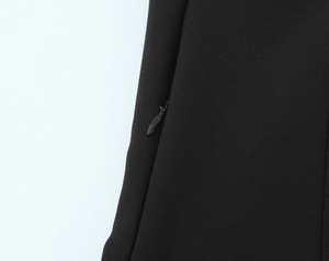 Detailed macro view showing the hidden zipper closure on black tube top fabric