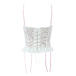 Detailed back view of white lace corset top featuring pink ribbon lacing and metal eyelets