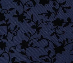 Detailed macro view of black floral flocking on navy semi-transparent mesh fabric