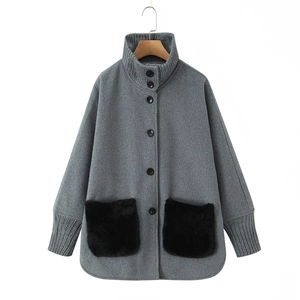 Women's gray knit jacket with stand collar, black buttons and fuzzy faux fur pockets