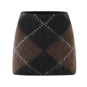 Detail of retro argyle knit mini skirt with fuzzy mohair texture and ribbed waistband
