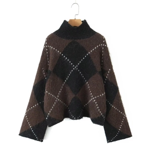 Close-up of retro plaid knit sweater featuring fuzzy mohair texture and ribbed turtleneck