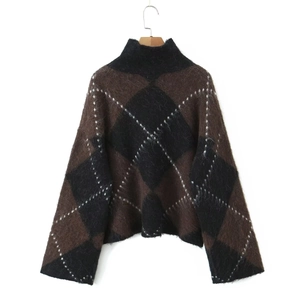 Close-up of vintage brown and black argyle knit sweater with mock neck and fuzzy texture
