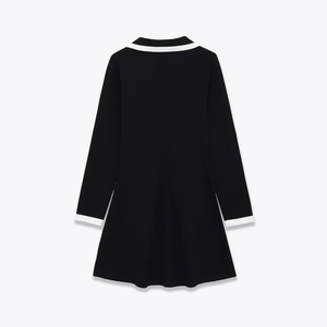 Back view of black long-sleeve dress with white contrast binding and a-line hem
