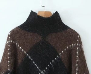 Close-up of fluffy mohair knit texture and plaid pattern on sweater and skirt set