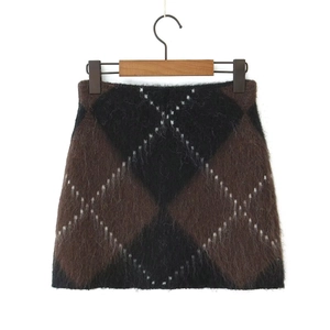 Detailed view of the argyle knit skirt featuring a plush brown and black plaid pattern