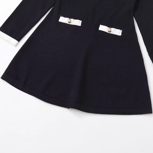Elegant black knit short dress with white contrast cuffs and gold button details