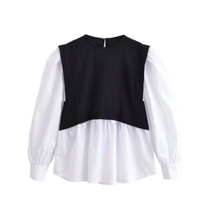 Women's two-piece style contrast knit top with puff sleeves and flared white hemline