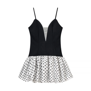 Detail shot of the V-neck bodice and polka dot hem on this slim fit mini dress