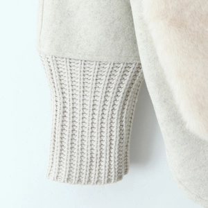 Women's white wool coat with knit sleeves and pink faux fur trim cuffs detail