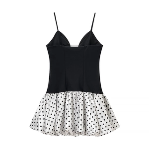 Detail of deep V-neckline and polka dot patchwork on backless slim strap dress