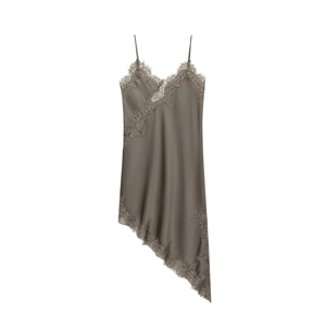 Macro view of taupe satin dress featuring delicate eyelash lace trim and asymmetric hem