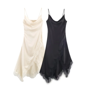 Detailed view of satin slip dress with delicate lace trim and thin shoulder straps