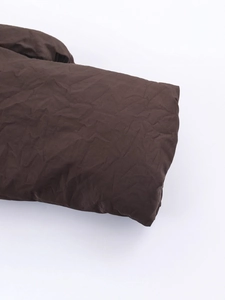 Women's dark brown puffer jacket with textured bubble fabric and ribbed cuffs detail