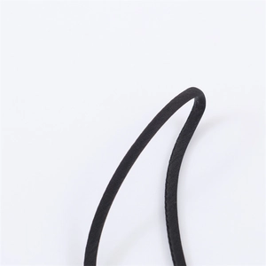Close-up of thin black satin strap with precise stitching on a sexy winter dress