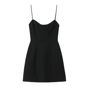Detail of a slim-fit black mini dress with sweetheart neckline and A-line waist cut