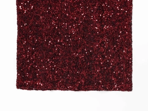 Close-up of premium burgundy sequin fabric showing dense texture and metallic reflection