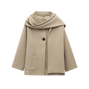 Detail of oatmeal wool blend coat featuring scarf neck design and large front pocket