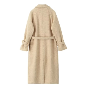 Back view of beige long teddy coat featuring a waist belt and sleeve strap details