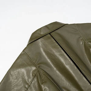 Detail view of olive green faux leather jacket with textured collar and precision stitching