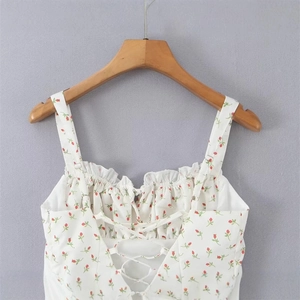 White floral spaghetti strap dress with red rose buds and lace-up back detail