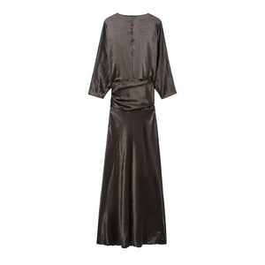 Detailed view of dark satin maxi dress with waist pleats and elegant draped silk texture
