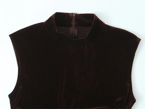Detail of dark brown velvet dress showing high neck and invisible back zipper closure