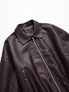Vintage dark brown PU leather jacket featuring a classic lapel and silver metal zipper
