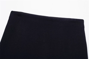 Close-up of black knitted waistband showing fine elastic texture and neat stitching