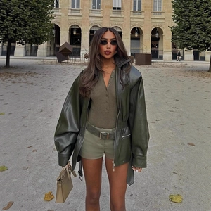 Deep olive green faux leather jacket with high collar and drawstring waist detail