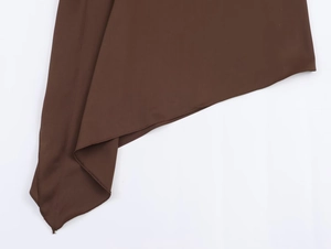 Detail view of smooth coffee brown satin fabric and precise edge stitching