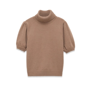 Detail of brown mock neck knit top featuring puff short sleeves and ribbed hem textures