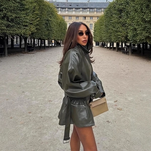 Chic olive green mid-length faux leather jacket with lapel and waist belt for women