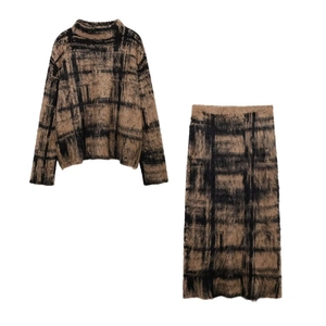Women's two-piece plaid knit set with sweater and midi skirt in brown and black