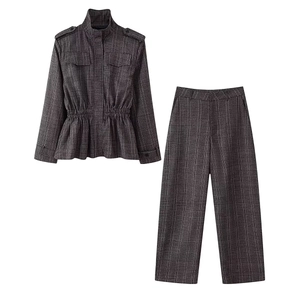 Detailed view of women's grey plaid two-piece set featuring drawstring waist and stand collar